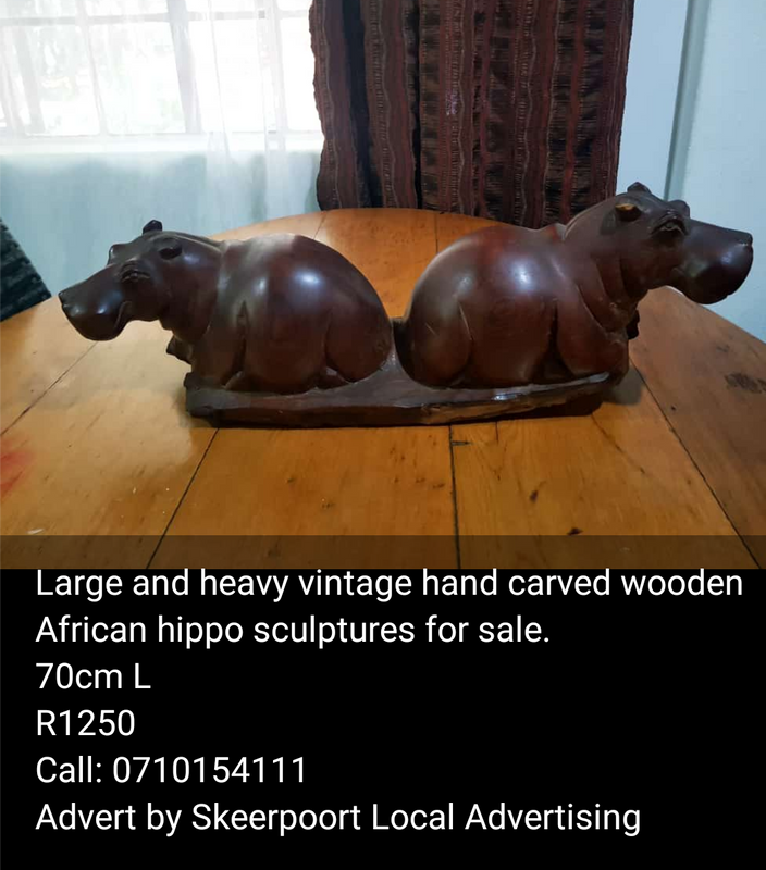 Large and vintage hand carved African hippo sculptures for sale