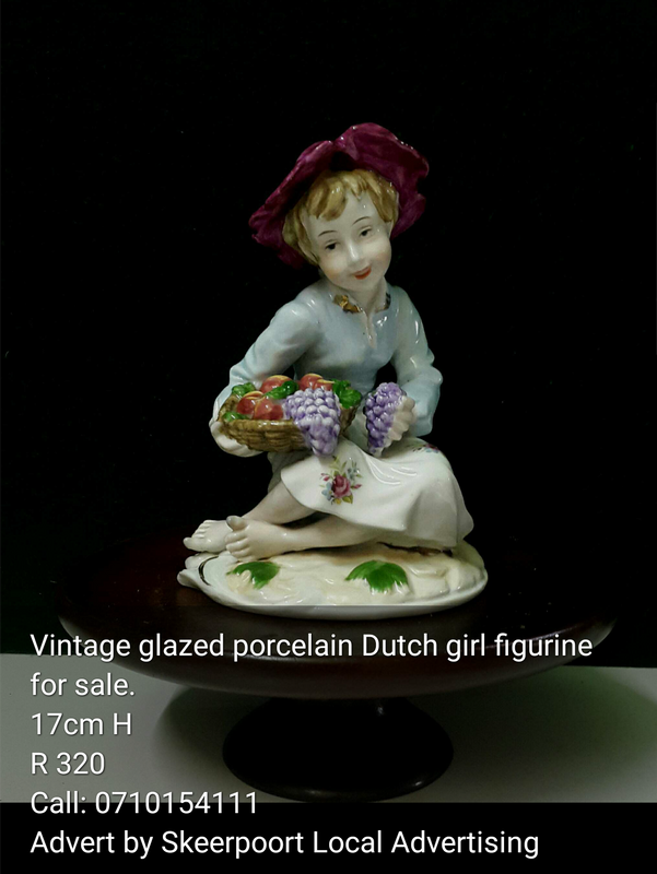 Vintage glazed porcelain Dutch girl figurine for sale