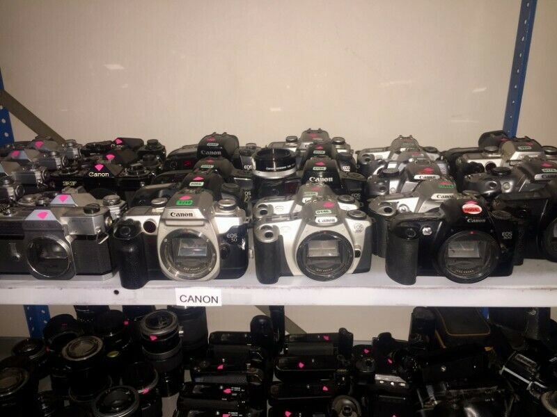 Collection of Canon Camera Bodies and Lenses with Cases