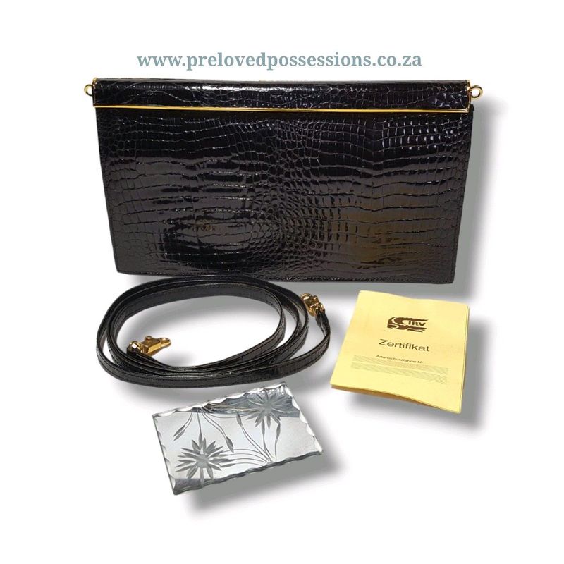 Crocodile leather clutch bag with strap