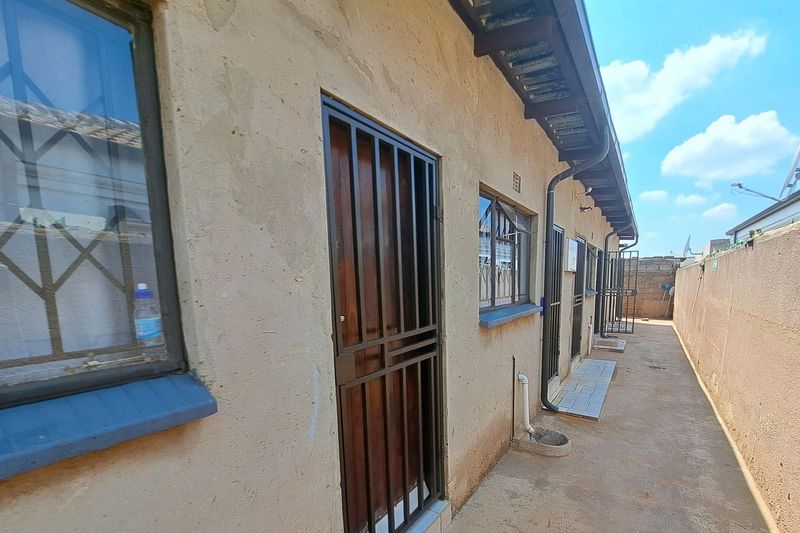 For sale in Phumula, Roodekop: A converted property comprising five units.