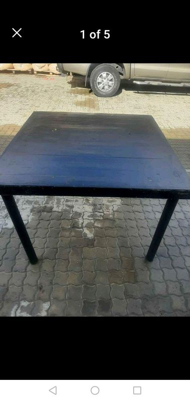 Wooden table with steel legs