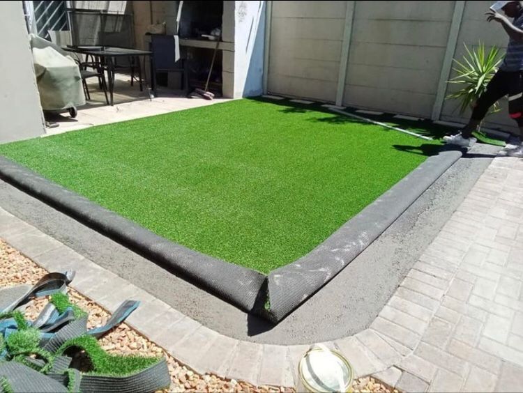 Artificial synthetic grass installation and instant roll on lawn grass