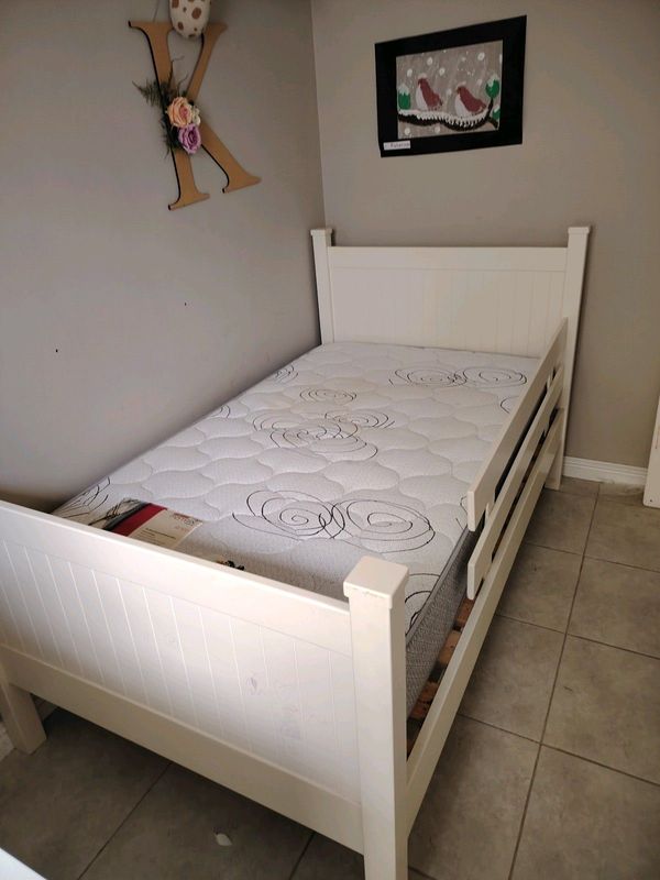 Solid wooden toddler bed with mattress
