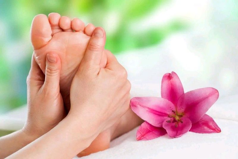 Toe nail cutting ang massaging of elderly feet to pamper and take care of feet and nail cuttings