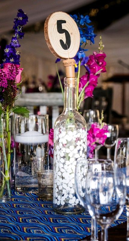 Rustic Wedding Table Numbers with Fairy Lights in Wine Bottles