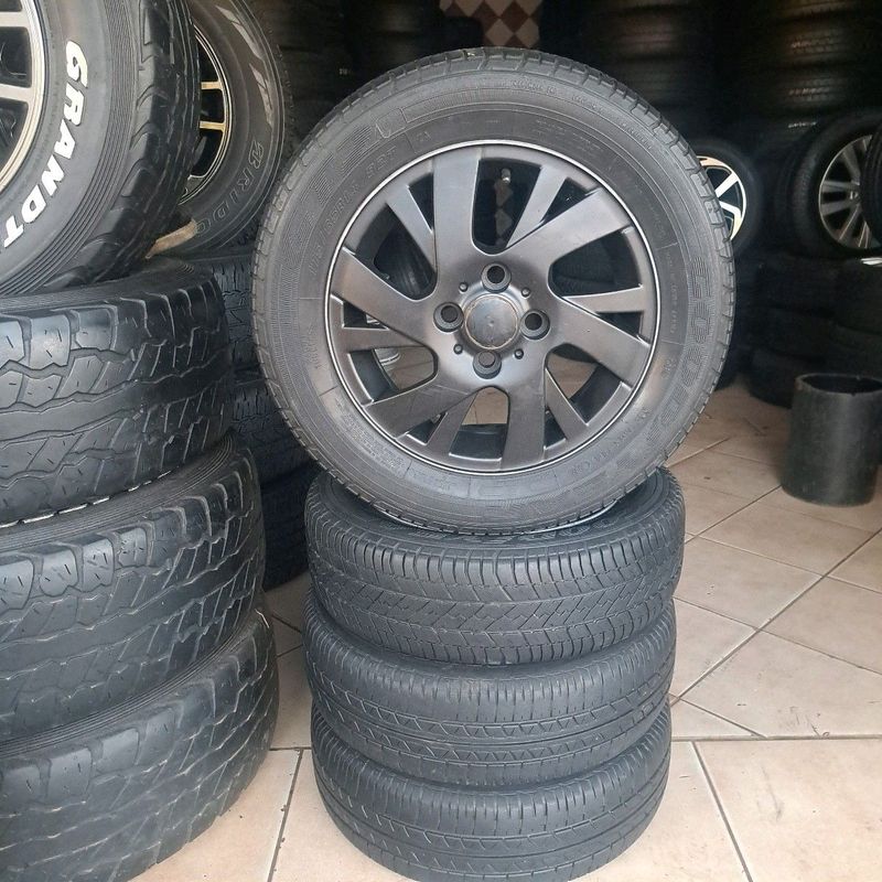 A set of 14inch mags and tyres pcd 4/100