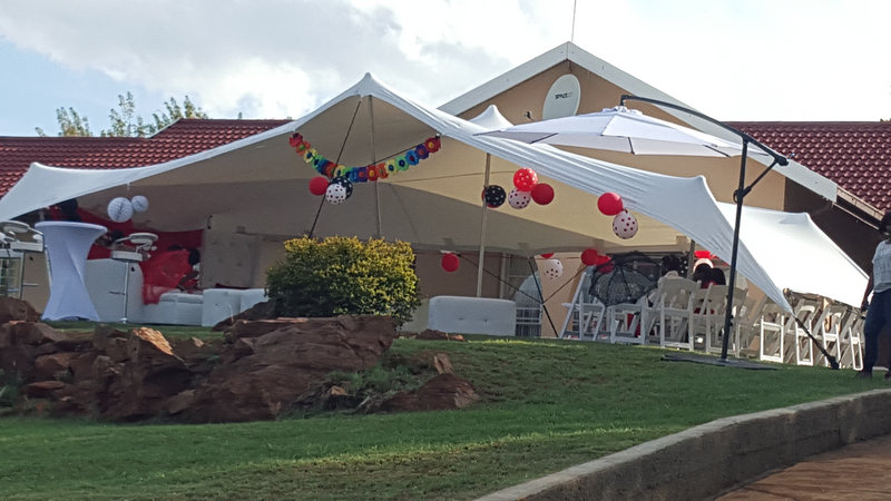 12x6m stretch tent(water proof),2x couches 5seater L shape(white leather),5 round tables, 2 cocktail