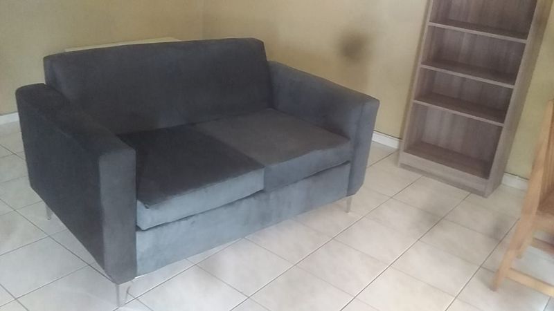 2 seater grey velvet couch