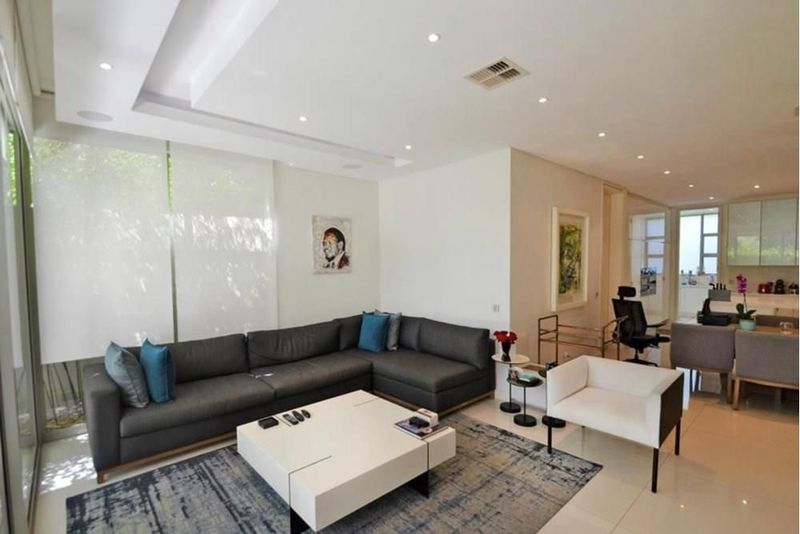 Modern and minimalistic garden apartment in prestigious apartment building