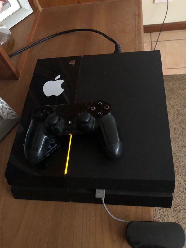 PS4 with games and controller