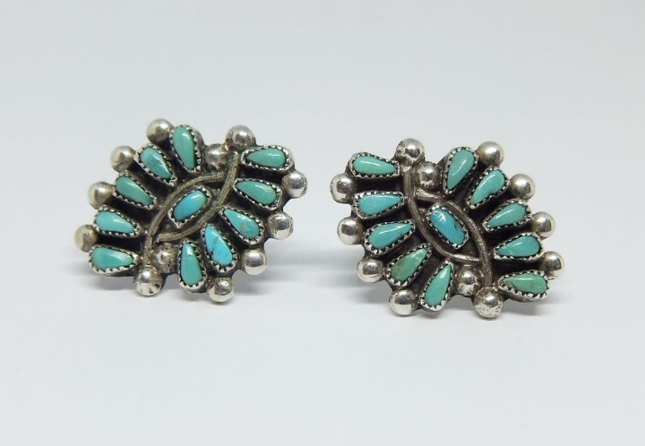 A vintage pair of Sterling silver screw on earrings with turquoise insets