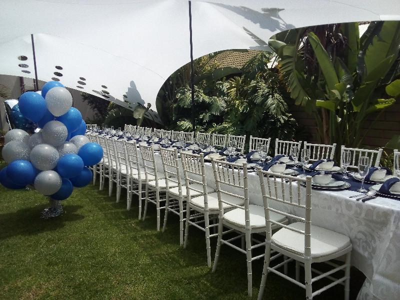 Backdrop and Balloons garlands decor. Tables, chairs, linen, cutlery and crockery hire.