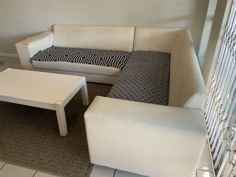 Spacious white corner set couch