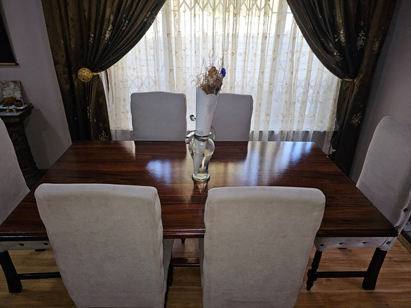 Dining  Table with 6 chairs and a Cabinet