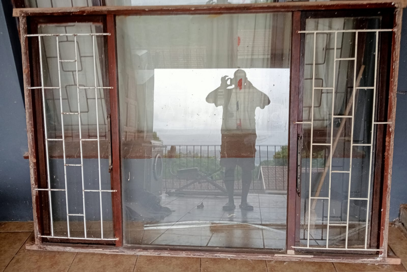Window frame including windows glass and burglar guards