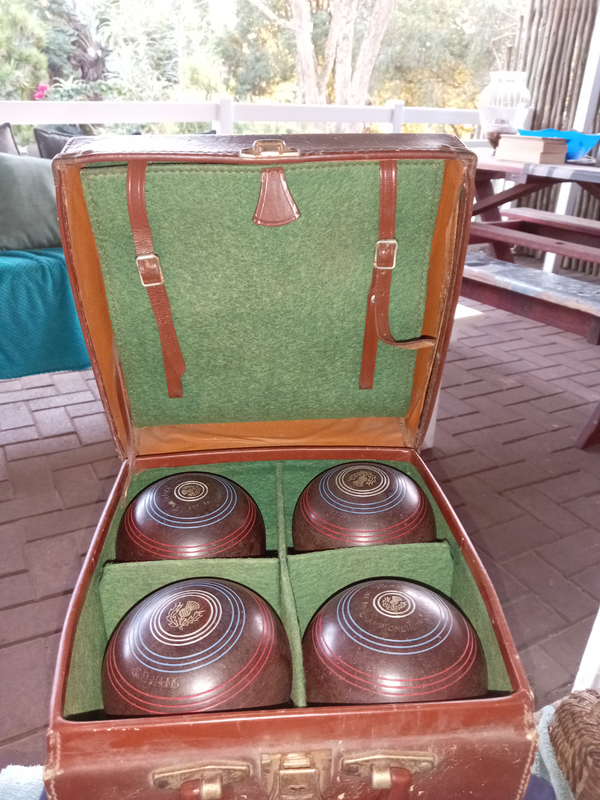Vintage set of 4 Henselite lawn bowls on solid leather case