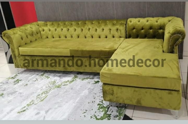 Green velvet corner couch with buttons