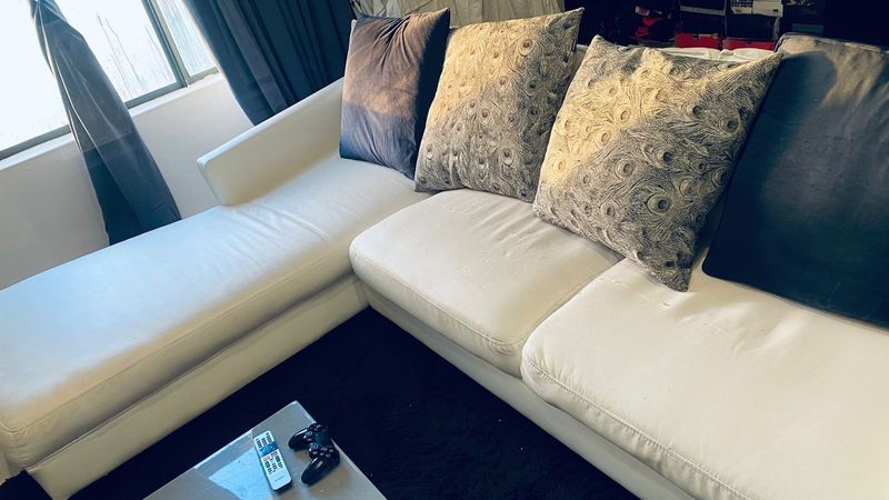 L SHAPED WHITE COUCH