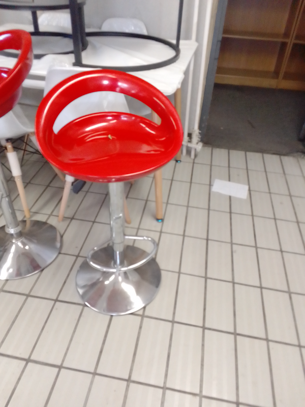 Red plastic bar stool