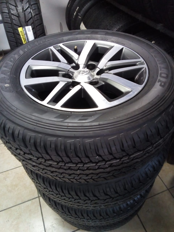 18inch Toyota Hilux/Fortuner original mags with brand new 265/60/18 Dunlop Grandtrek A/T set R15500.