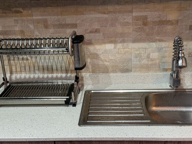 Kichen tap and sink with dishrack