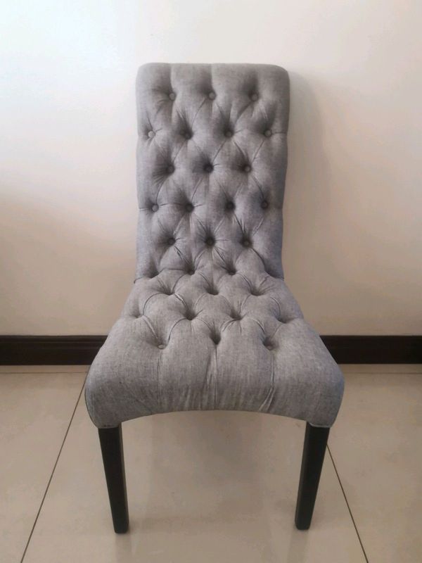 A brand new exquisite gray battoned occasional chair.