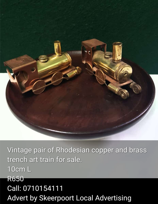 Vintage pair of Rhodensian copper and brass trench art train for sale