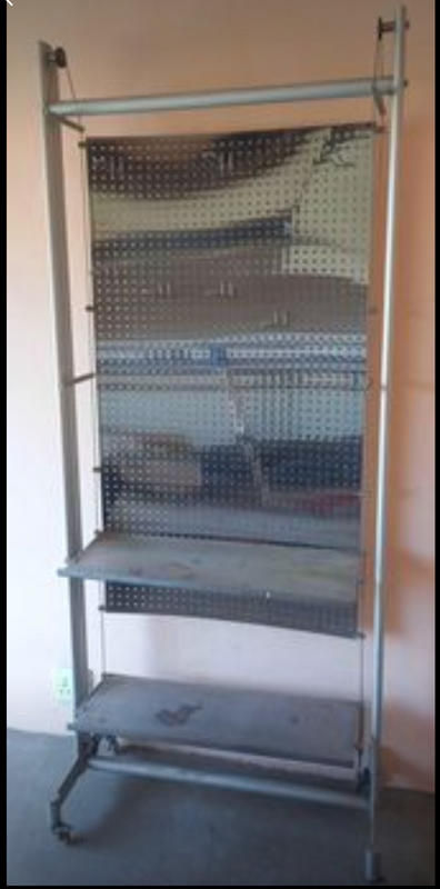 Display stand.Unused, been in storage for a few years.Aluminum frame with stainless steel pegboard.2