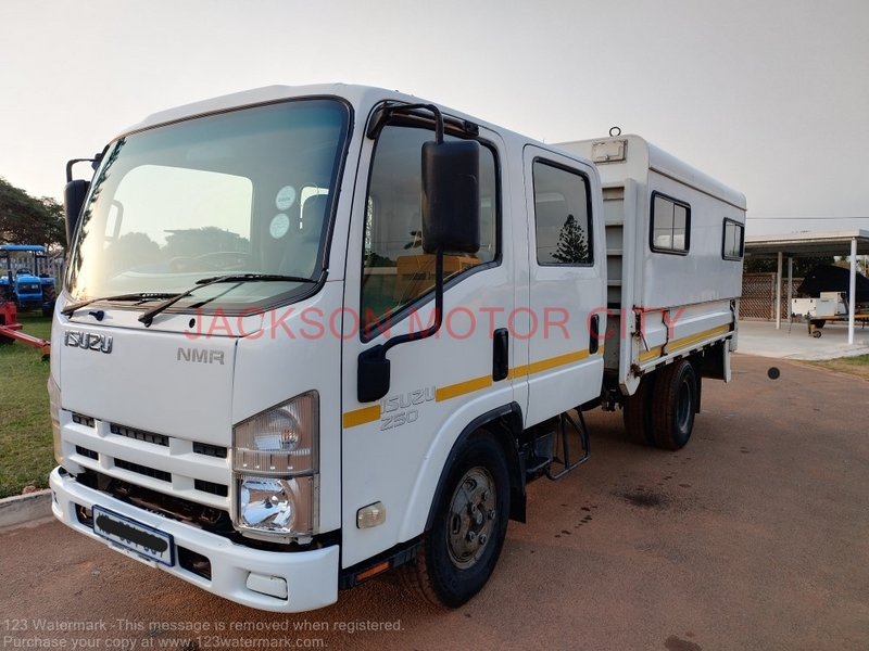 2011 - ISUZU NMR250 CREW CAB WITH DROPSIDE BODY AND CANOPY