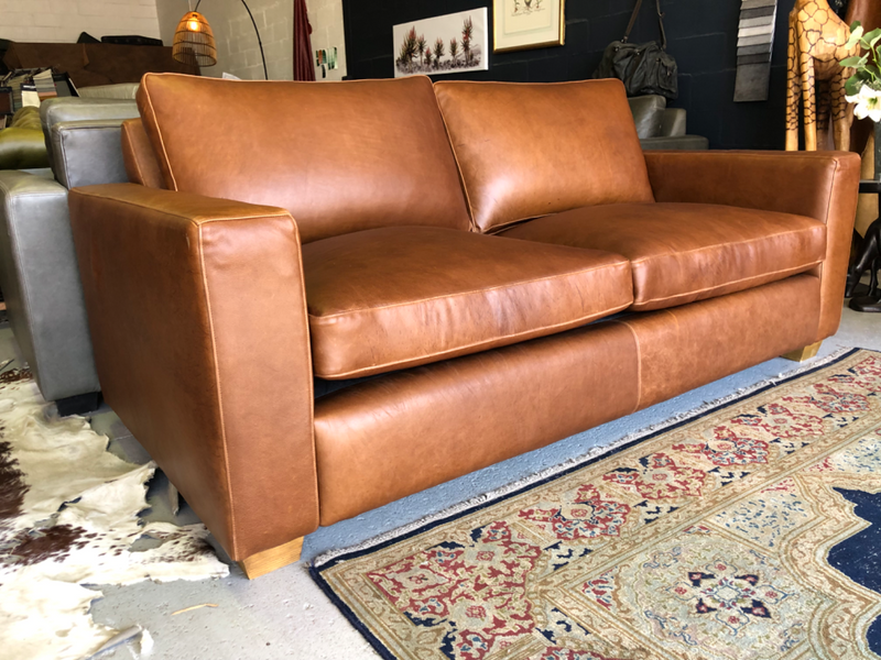 Immaculate 2m full grain gameskin genuine leather CONTEMPORARY DESIGN two seater sofa, Brand new.