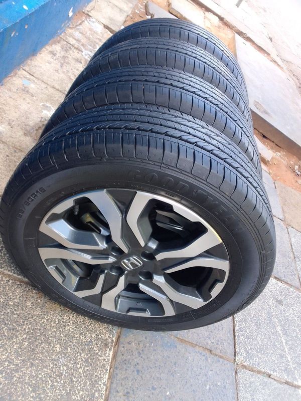 A set of 16inches original Honda WR-V mags rim 4x100 PCD with 95% thread tyres both rims and tyres