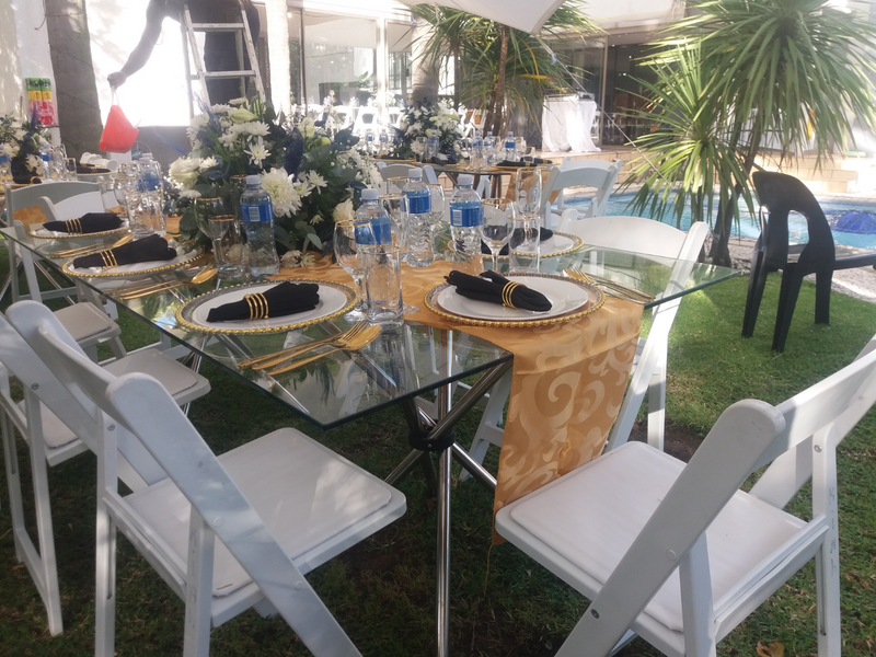 FULL DECOR SET UP WITH GLASS TABLES AND WIMBLEDON CHAIRS. TABLES AND CHAIRS HIRE. STRETCH TENT HIRE.