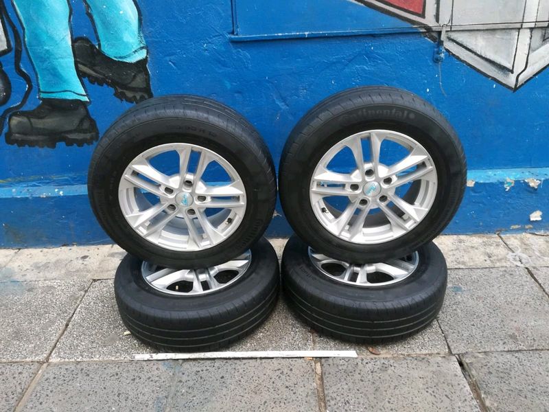 A set of 15inches 5x114 PCD mags with continental tyres for Toyota corolla quest /Toyota professiona