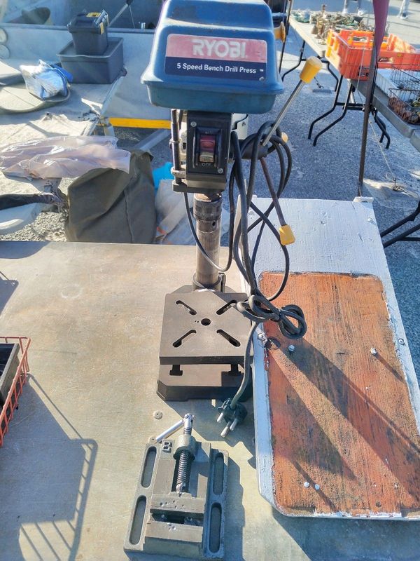 Drill press with vice and wall bracket