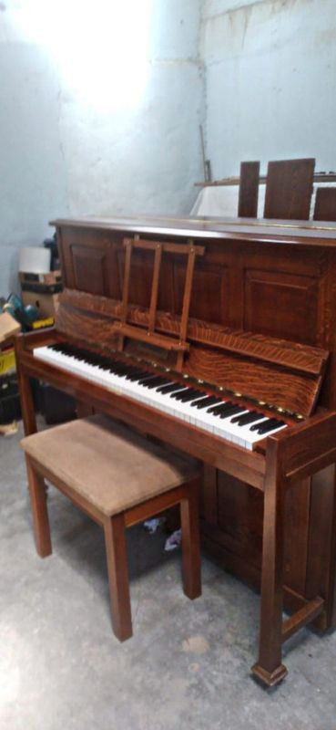 Upright Piano in excellent condition for sale.