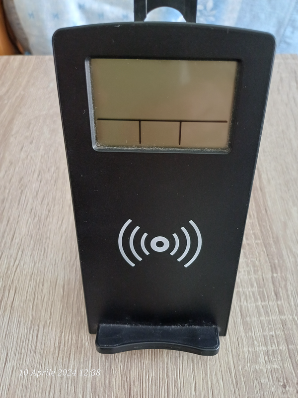 Wireless charging station with alarm clock