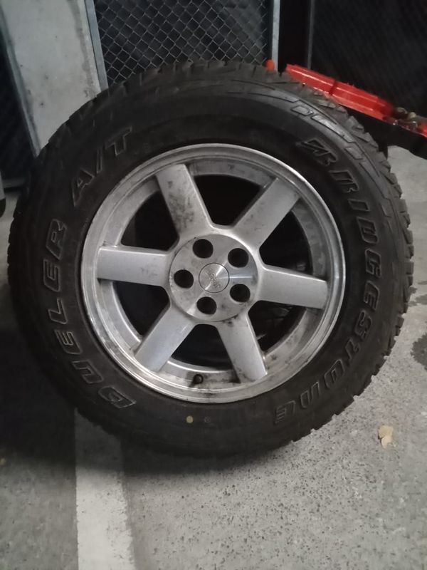 Three rims with tyres on.