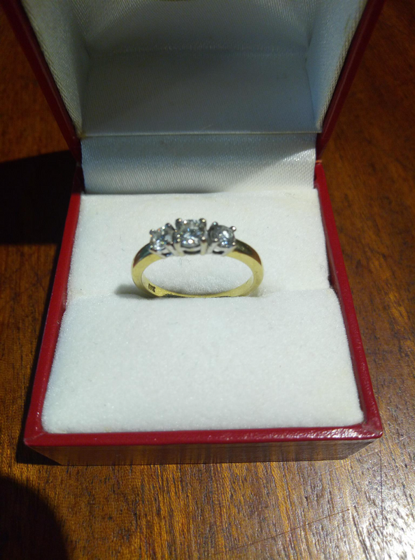 18ct white and yellow gold diamond trilogy ring.