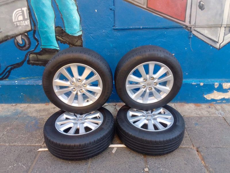 A set of 16inches original toyota corolla quest mags 5x114.3 PCD with tyres also fit toyota urban