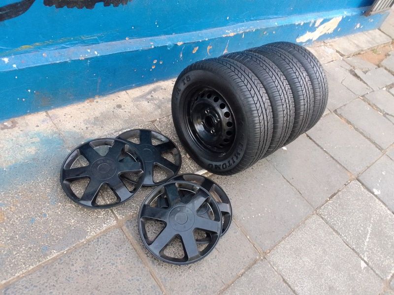 A set of 13inches original Datsun go steel rims 4x100 PCD / wheel covers and tyres. Tyres are 97%