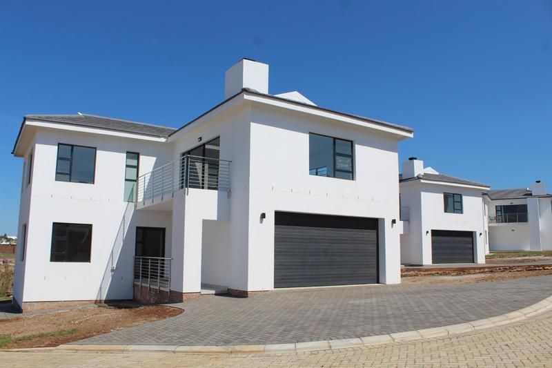 Modern double-storey home with a sea view in security estate.