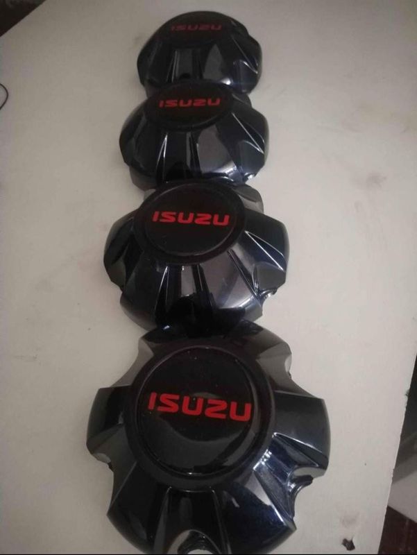 ISUZU Xrider Wheel Center Caps A Set Of Four On Sale.