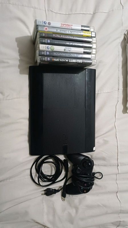 PS3 / Playstation 3 with 7 games and wired controller