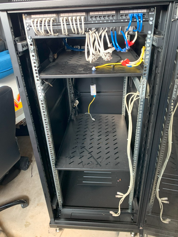 27u x 1m deep server rack. (Black), 4x Fans, 2x Shelves, 1x Patch panel, 1x Brush Panel