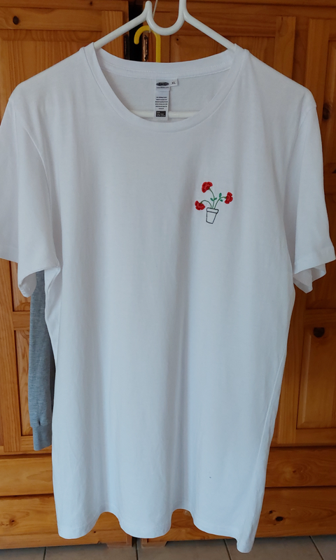 Hand embroidered flowers on a white t-shirt