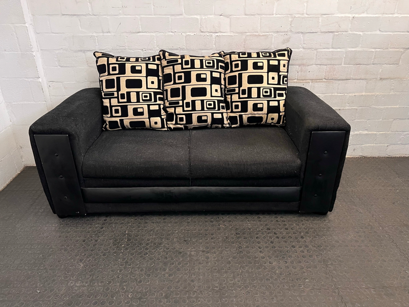 Black Fabric Three Seater Couch with Black and Beige Patterned Cushions- A47469