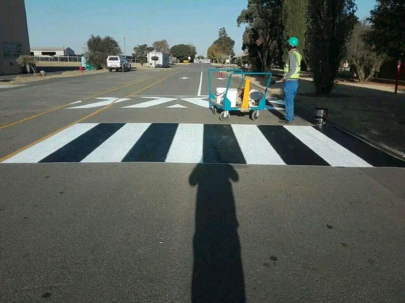 Roadmarkings parking bays stops signs warehouse markings and speed humps painting