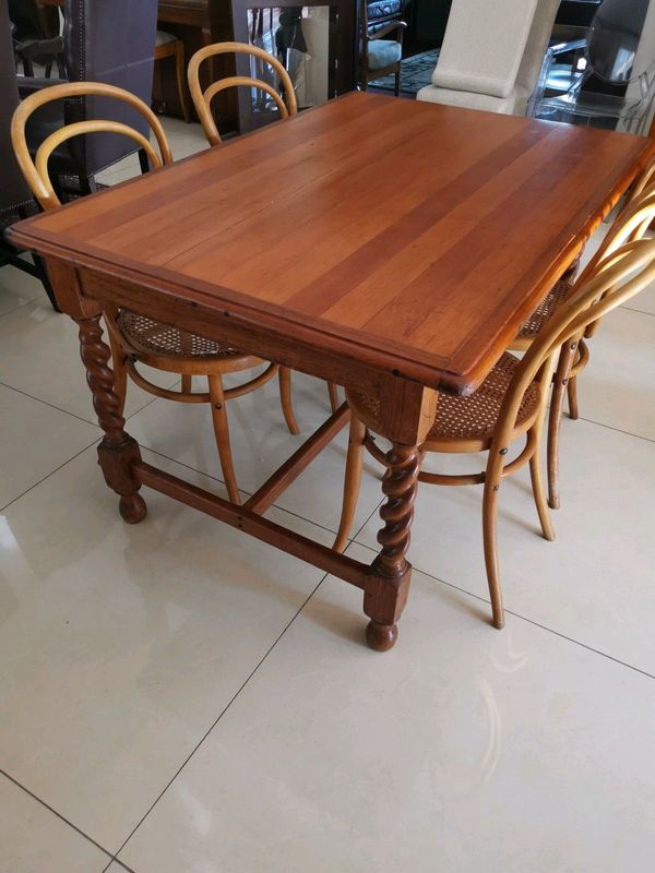 An antique 6 seater Bali twist dinning table with 4 chairs. In excellent condition.