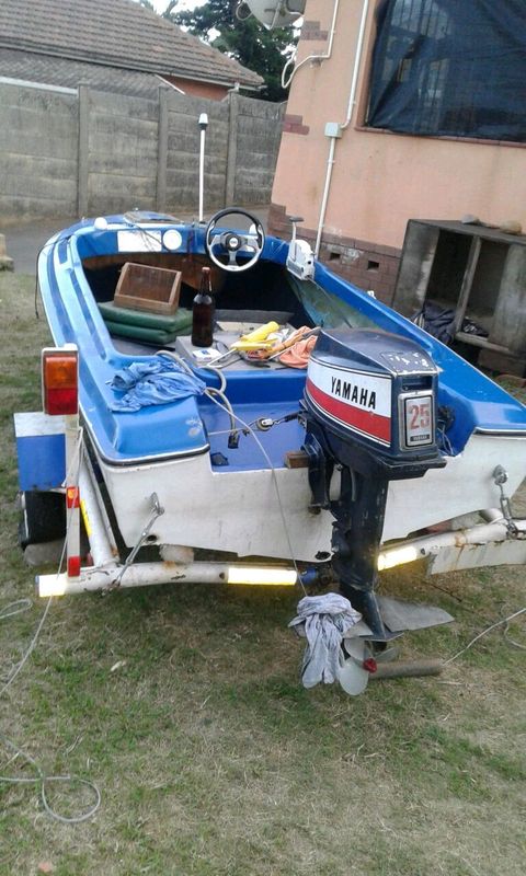 Boat on trailer with motor
